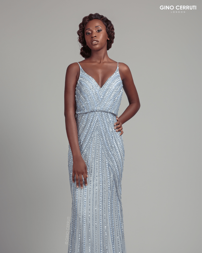 Hand beaded dress with drape bodice and spaghetti straps, complete with an open back. 