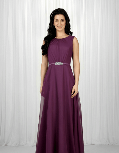 Floor length gown with high neckline and button detailing at the back, and beading at the waistline.